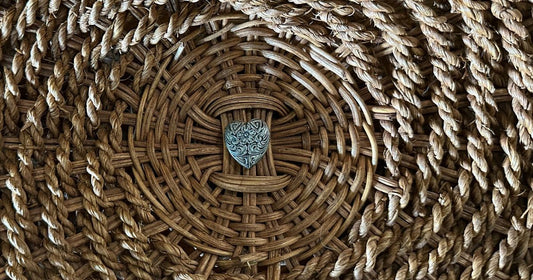 Silver heart charm in a basket