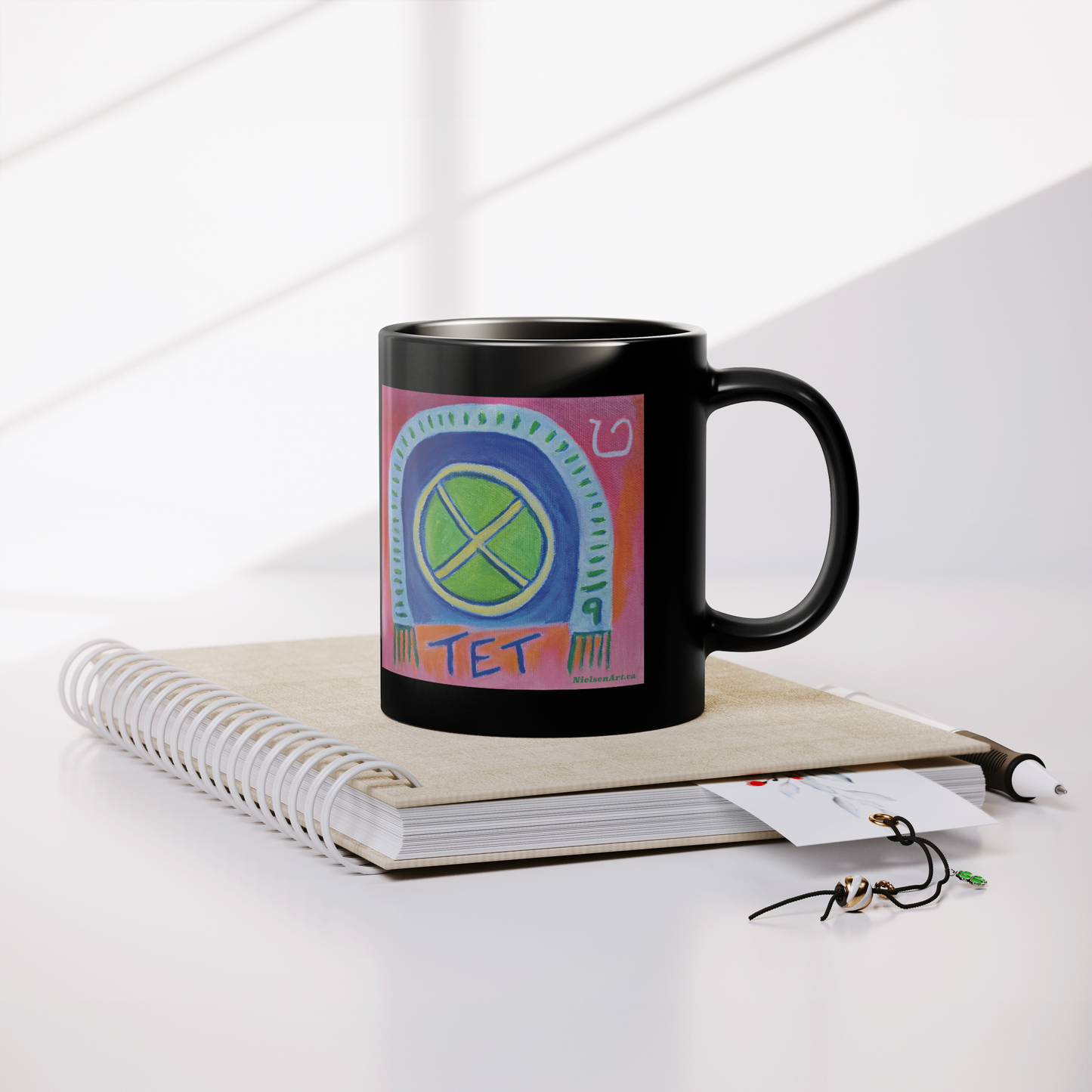 TET_Glossy_Black_Mug__Whats_in__Lifestyle_Notebook_Mockup.png