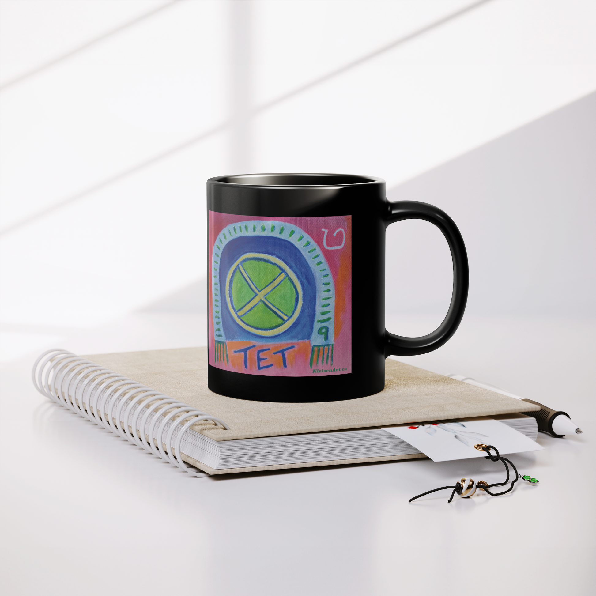 TET_Glossy_Black_Mug__Whats_in__Lifestyle_Notebook_Mockup.png