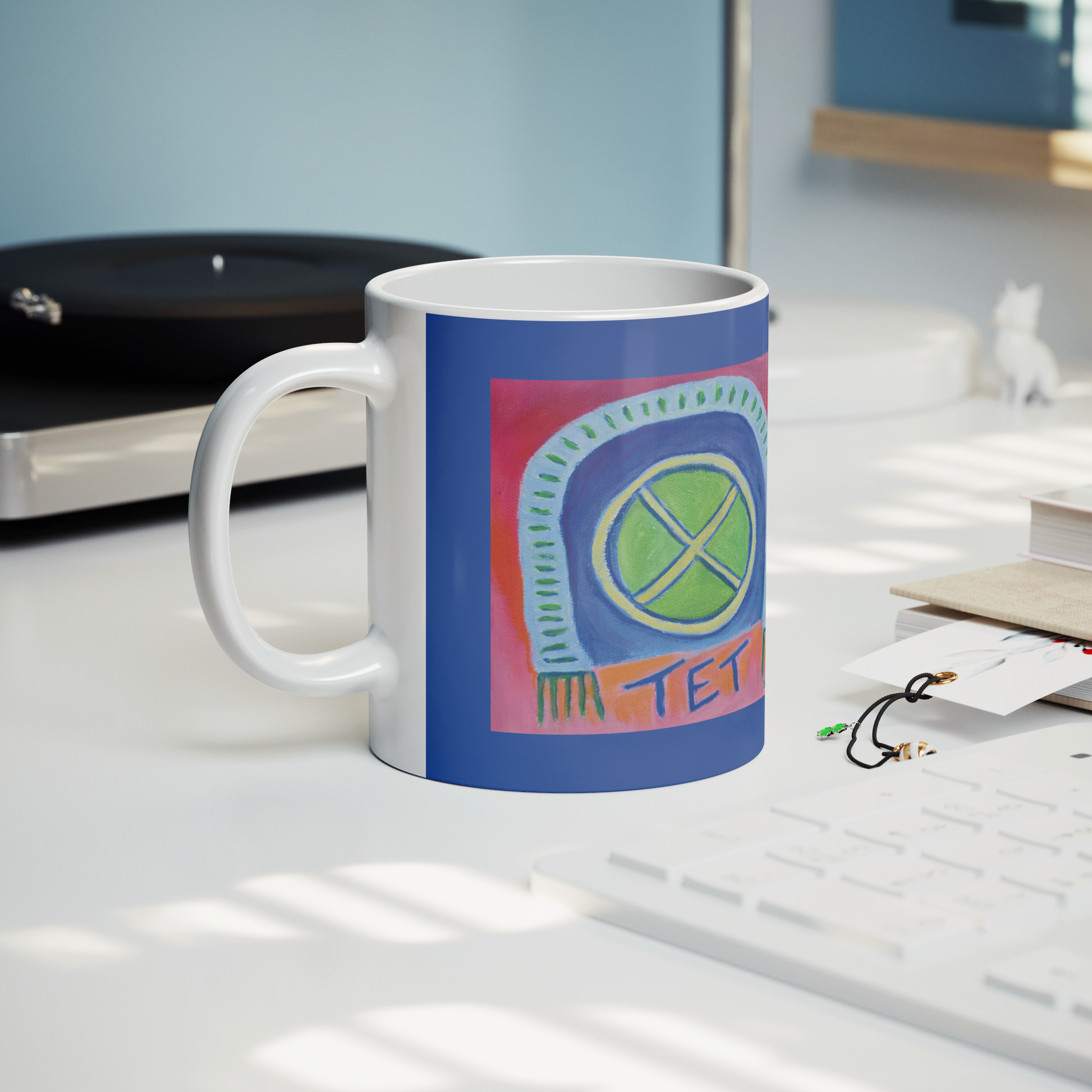 TET_White_Mug__Whats_in_Your_Ba_Lifestyle_Record_Player_Mockup.png